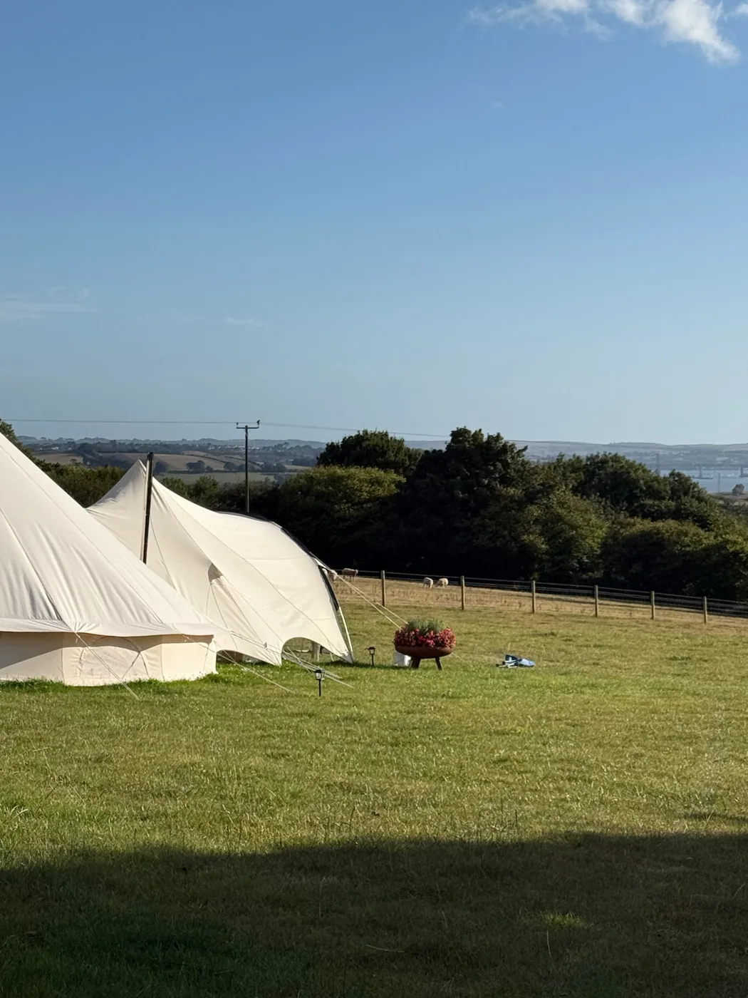 A bell tent on the field with long views over the countryside
